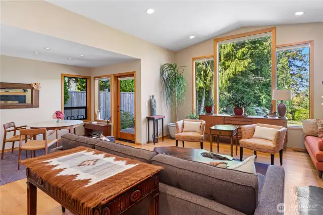The living room and layout are fabulous, with abundance of natural light, vaulted ceilings, hardwood floors. The door in the background on the left side of the photo leads out to the spacious personal pation.