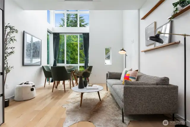 Floor-to-ceiling windows drench the space with natural light.