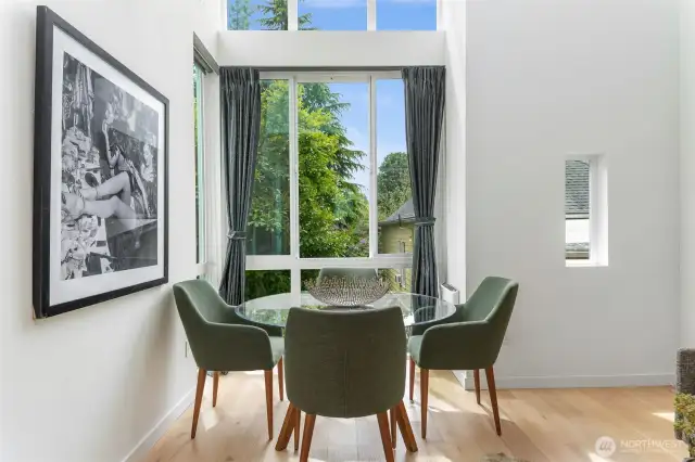 Light and airy dining area with vaulted ceilings. Enjoy urban living and still have those green views!