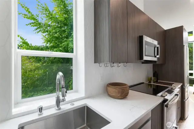 You'll actually enjoy doing dishes with this scenic view!