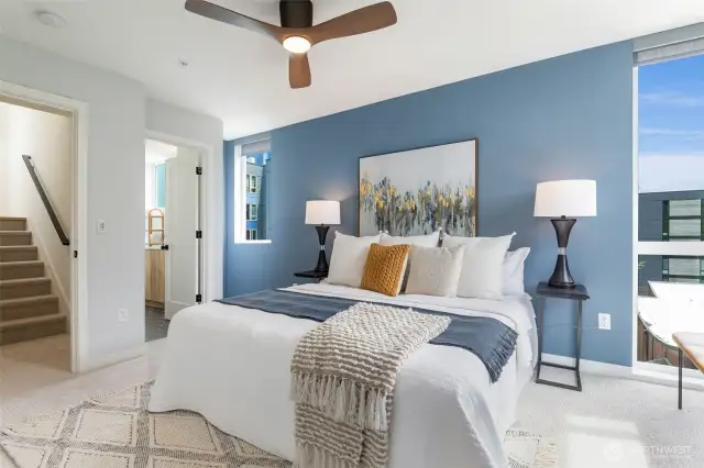 Primary bedroom features an en-suite bathroom & double closets.  Just head up the stairs to your private rooftop deck!