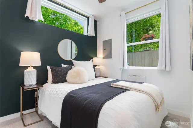 Enjoy serene views from the spacious bedroom on lower level.