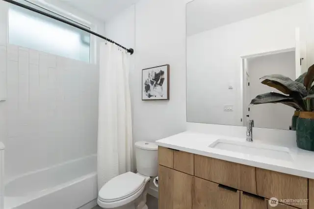 Tastefully designed full bath on lower level.