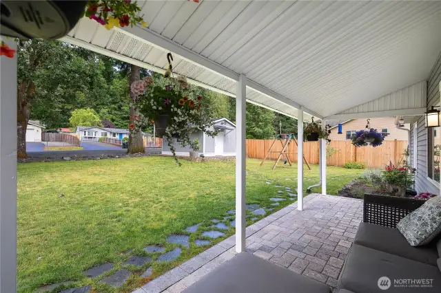 Cute front porch ready for you to relax and enjoy your beautiful yard.