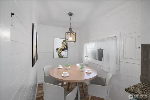 Eating space off of kitchen. (Virtually Staged)