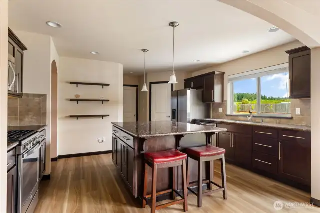 Fully equipped kitchen with granite counters and large island
