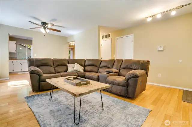You'll love the effortless flow from room to room in this home. Easily navigate from the living room to kitchen and dining room. Note the storage closet and door to the garage just down the hall!
