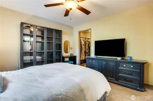 The walk-in closet can house an expansive wardrobe and has space for an additional dresser between the hanging racks!