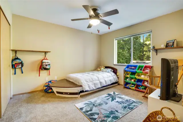 Third bedroom upstairs features a ceiling fan and freshly cleaned carpets!