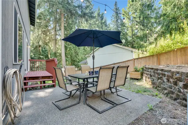 The concrete patio is the best spot for your weekend BBQ feasts or your afternoon beverage while listening to the birds chirp and fly by. There are multiple terraces to the right, which would be a perfect spot for raised garden beds!
