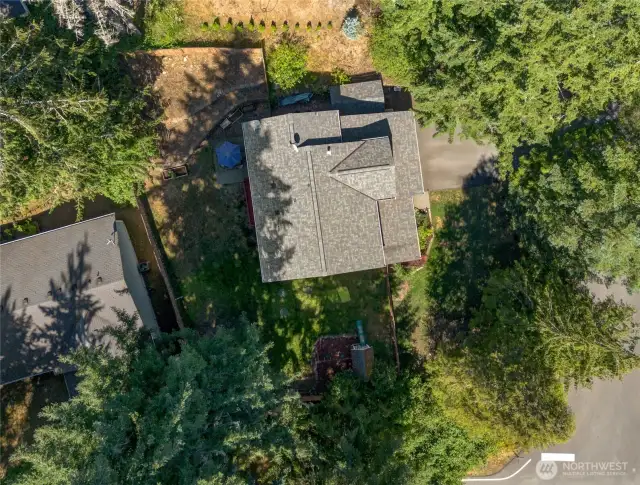 The birds-eye view of this lot shows off the natural setting and extra privacy—a great mix of sun and shade throughout the day for your plants and garden beds.