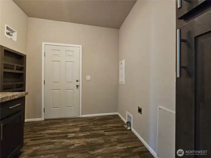 Laundry Room with side door to walk way