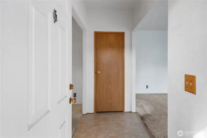 Come on in!  A concrete path brings you around to the formal entry of the home.  To the left is the dining room, and to the right is the formal living room.