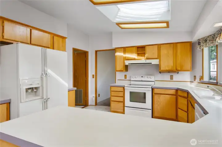 Fridge, range and dishwasher included.