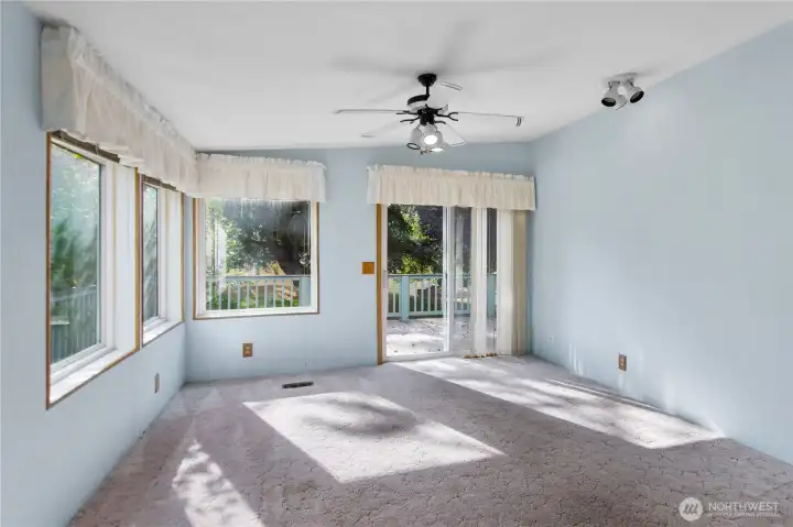 The family room has access to the beautiful trex deck which overlooks the greenbelt of lawn and trees.  Plenty of space for your BBQ and patio furniture.
