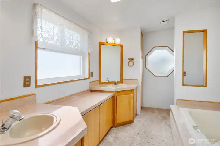 Primary 5 piece bath has a sequestered commode and TWO linen closets!  Additionally there is an oversized shower and deep soaking tub.