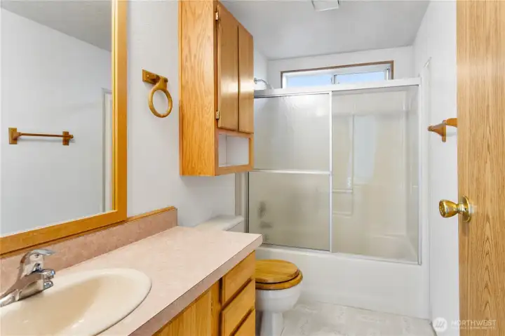 The main bath is located between bedroom #2 and badroom #3.