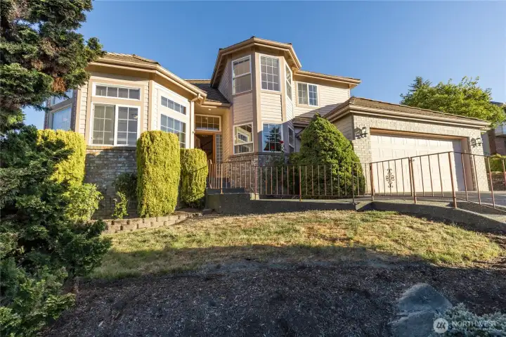 Another street view of the home, showing the front yard