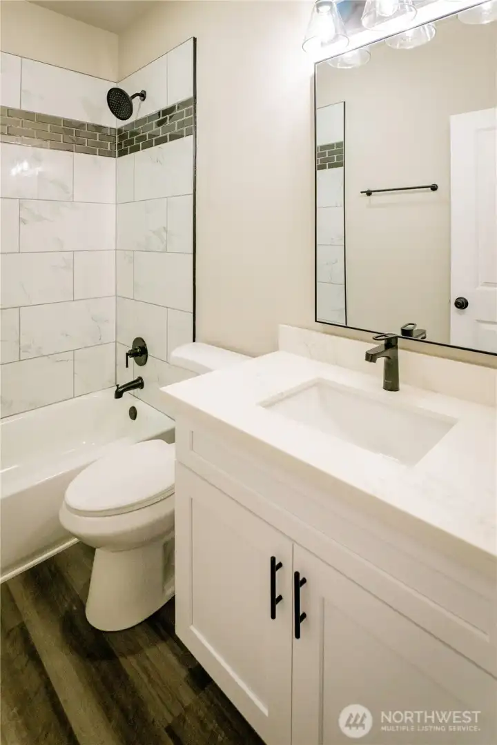 MAIN BATH IN HALLWAY...PLENTY OF STORAGE UNDER THIS NICE SIZED VANITY