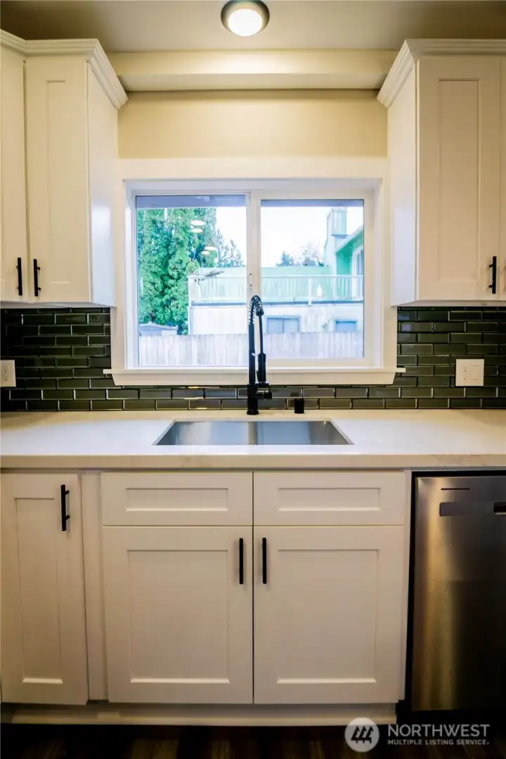 UNDERMOUNT SINK..AND A NICE VIEW OF THE DECK WHEN YOU GET STUCK DOING THE DISHES