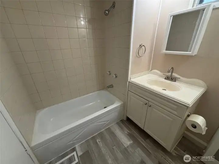 Bath with new flooring and faucet