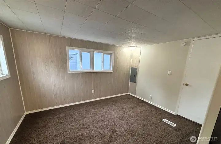Primary bedroom with windows on two sides