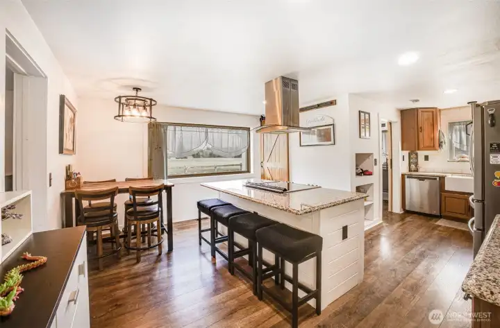 Updated Kitchen featuring granite countertops and and built in cook top, stainless steel appliances, Eat- In Kitchen with a window that faces Mount Rainier!