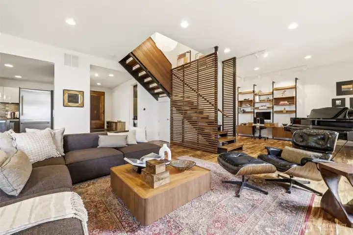 Architectural living space defined by volume, warmth, and light