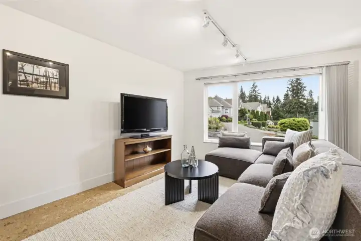 Cork flooring throughout this separate living area above the garage, with hardwood floors in the kitchen.