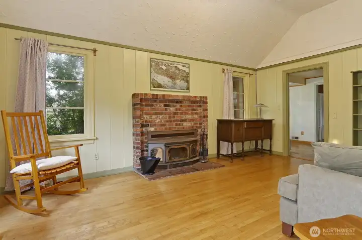 Main floor living room - cozy wood-burning fireplace with insert for efficiency