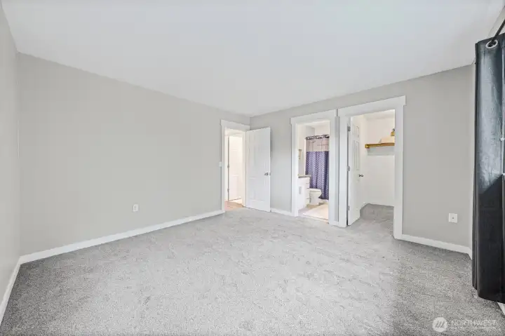 Primary bedroom with en-suite and walk-in closet.