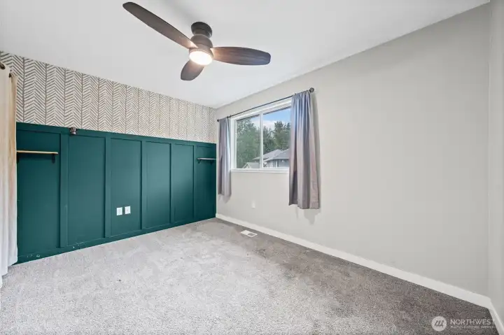 Bedroom two with a view to the side yard.