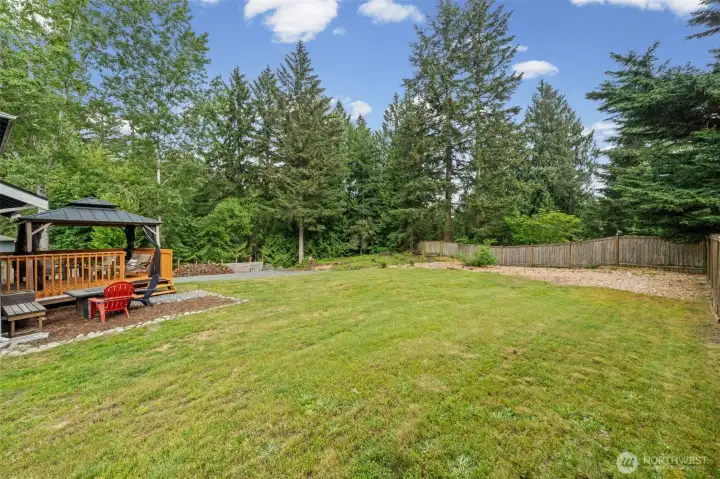Isn't this back yard amazing?  Wood pile ready for your use.  So many opportunities for a garden, a play area, room for your fur babies to run - what will you do back here?