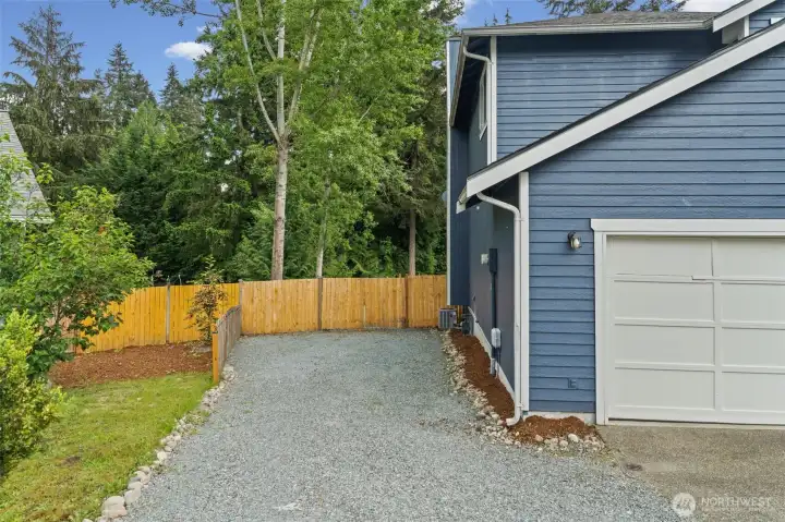 Additional parking on the side of the home  Also notice the gate to the back yard.