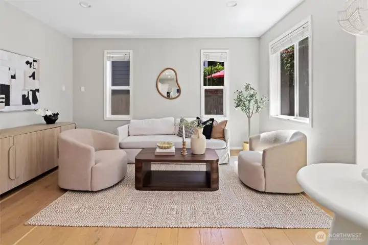 Main living room, open concept into kitchen with dedicated eating space