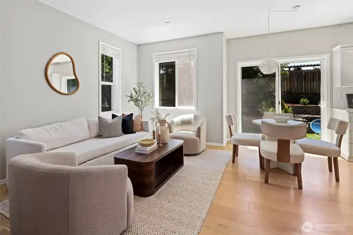 Main living room, open concept into kitchen with dedicated eating space