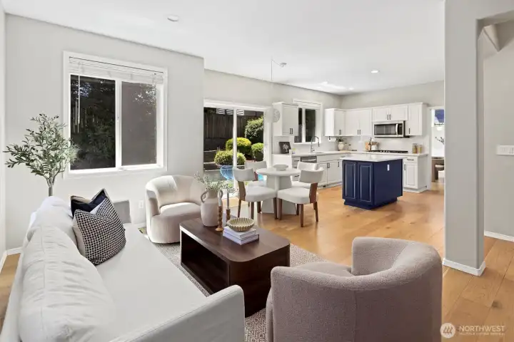 Main living room, open concept into kitchen with dedicated eating space