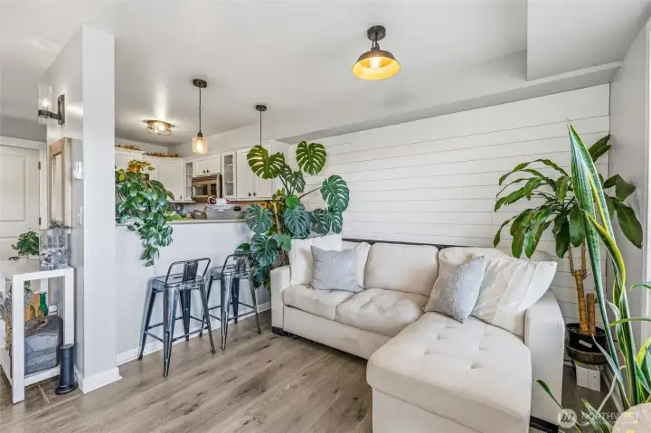 Living Room w/ Shiplap Accent Wall & Breakfast Bar