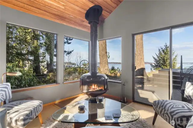 Get comfortable while you enjoy the warmth of the wood burning fireplace, and vast views.