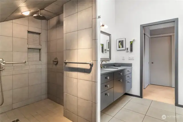 Enjoy a rainfall shower and heated floors in this ensuite bathroom!