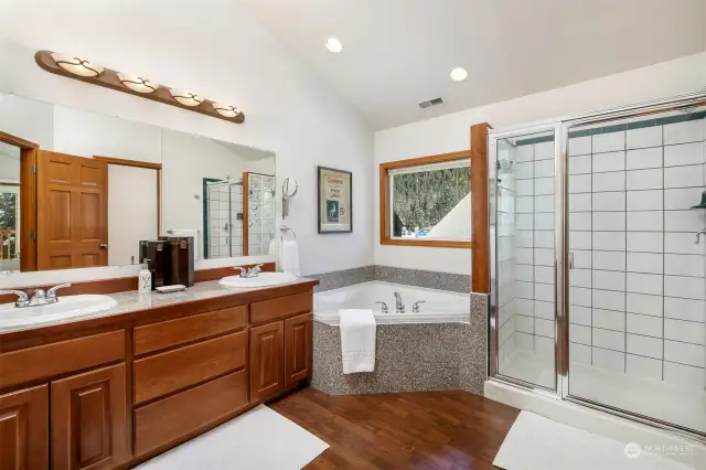 Resort-Style spa bath with twin sinks, relaxing soaking tub, luxury shower and private water closet.