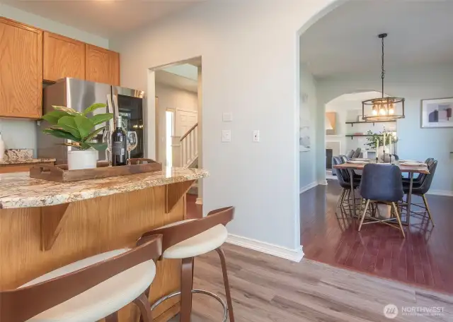 Island kitchen connected to dining area.