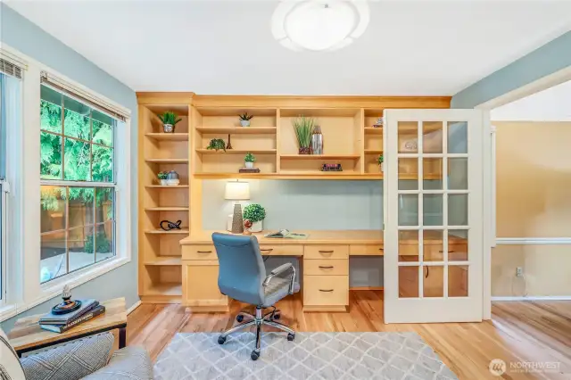 Thoughtfully designed built-in shelves and desk space provide ample storage and organization, making this office a highly functional workspace.