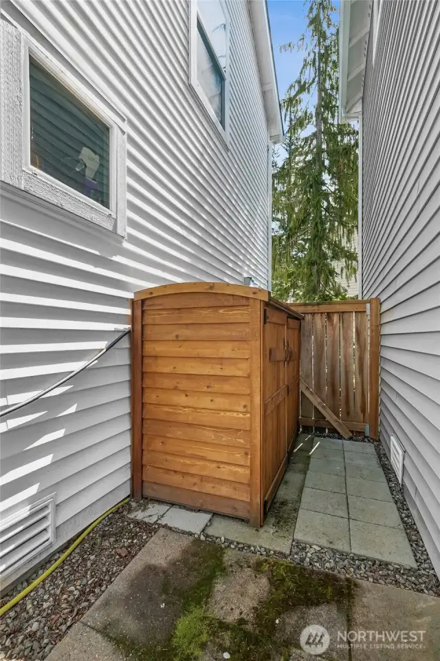 Storage shed on side of home