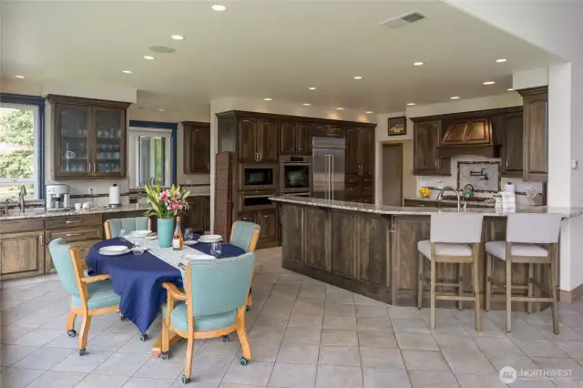 Primary kitchen equipped with Miele double oven, warming oven, microwave & Bosch dishwasher. Scullery kitchen features additional Bosch dishwasher, two oversized refrigerator drawers, deep sink plus ample counter and cabinet space. Massive walk-in pantry behind kitchen and dining area.