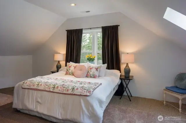 Bright and sunny upper level bonus room with skylight.