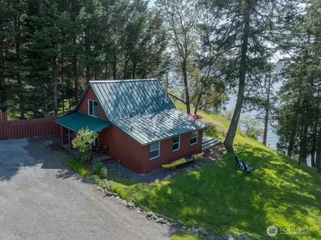 Second cottage hugs the shoreline.