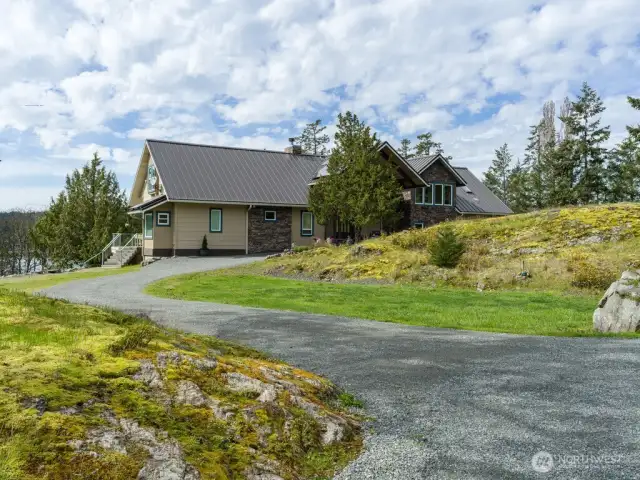 Drive right up to the front door or continue on to the two car garage below.
