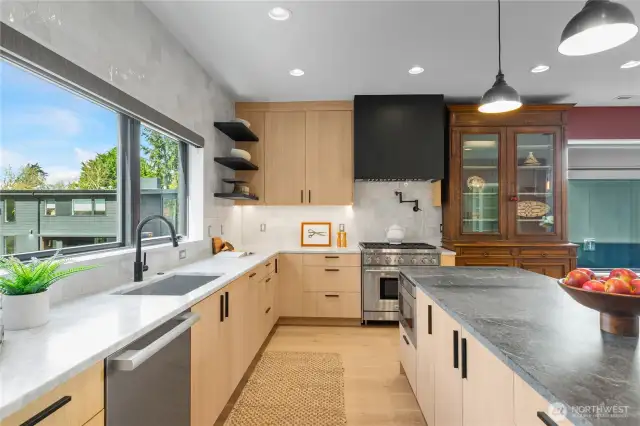 Wolf 6-burner gas oven. Zephyr hood designed to cover all burners. Plus, an awesome pot filler!