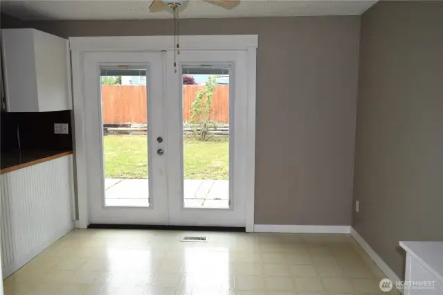 French doors to large fenced back yard
